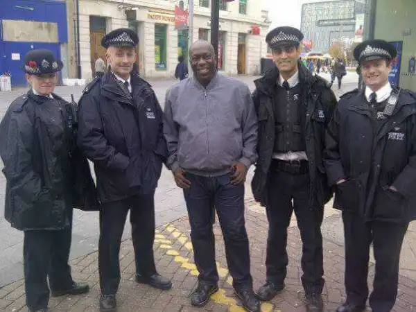 Picture Of Nollywood Comic Actor, Charles Awurum, With British Policemen